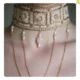 Handmade women's necklace decorated with stones and chains