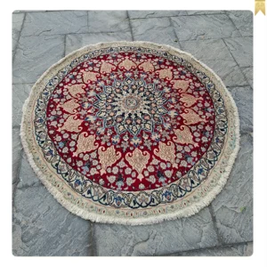 A pair of handmade Nain round rugs, 1.5 meters in diameter