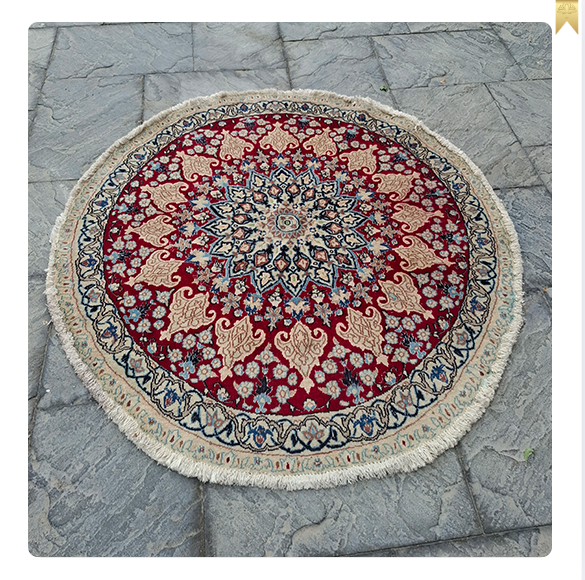A pair of handmade Nain round rugs, 1.5 meters in diameter