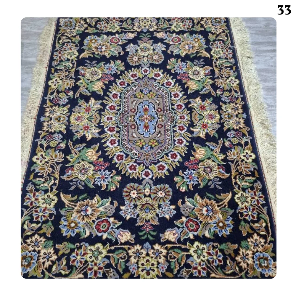 A pair of handmade Kashan carpets, silk flowers